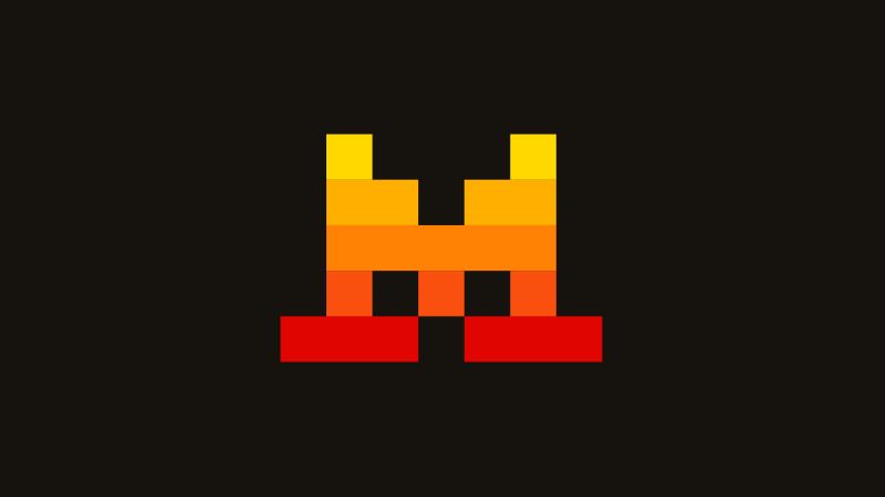 Logo de Mistral AI : des carrés pixelisés jaunes, orange et rouges, sur fond sombre.